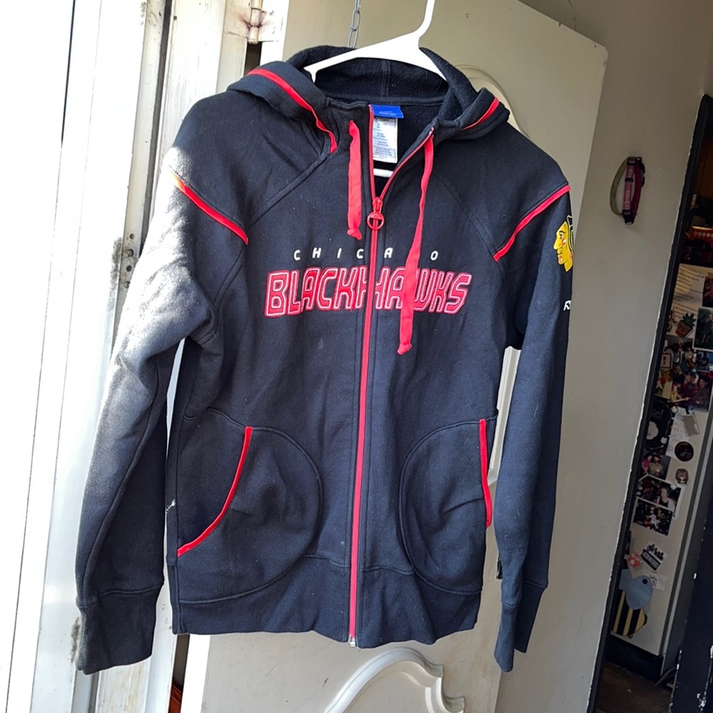 Chicago Blackhawks small women’s zip up jacket with hood.